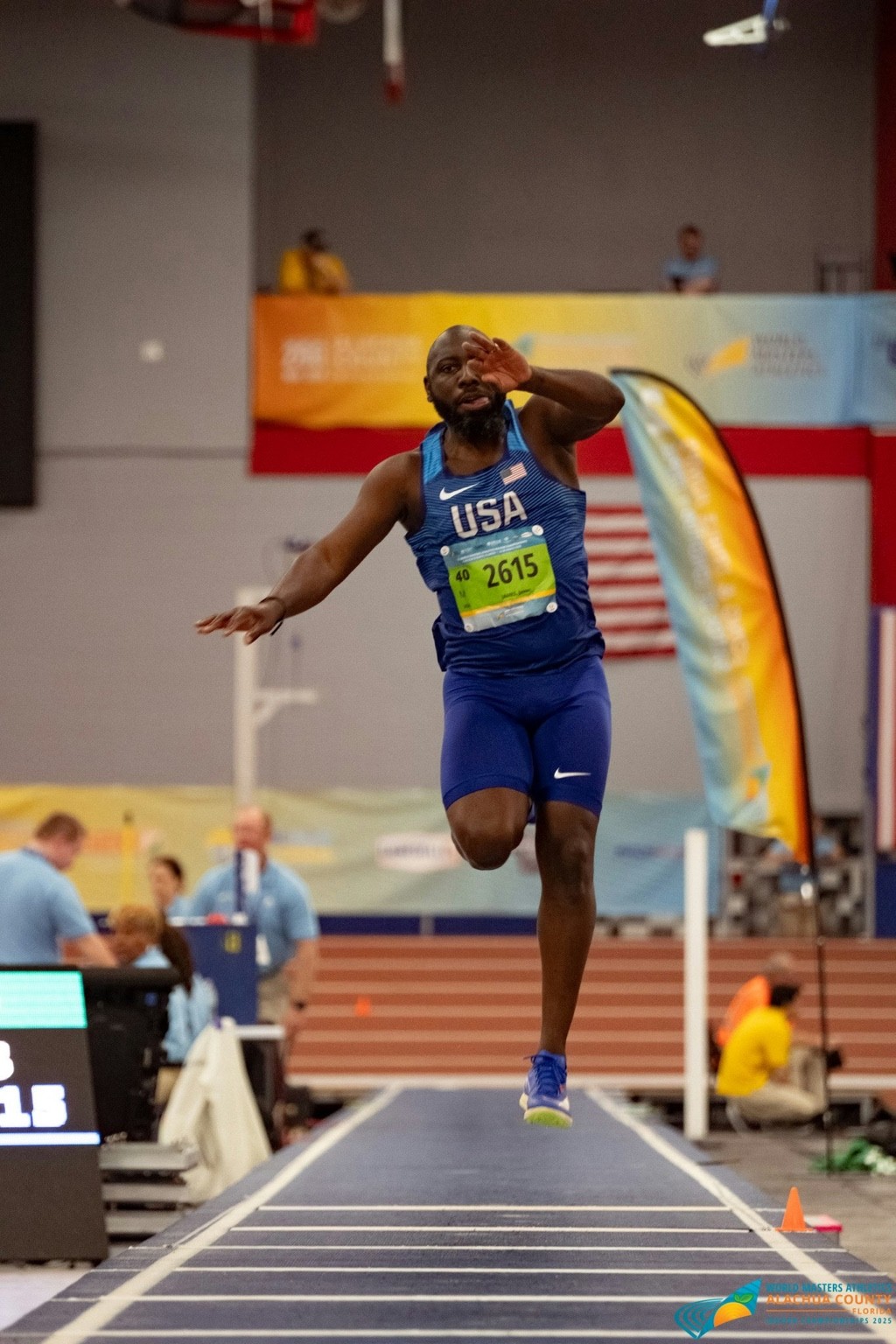 Jason James in flight during a long jump competition